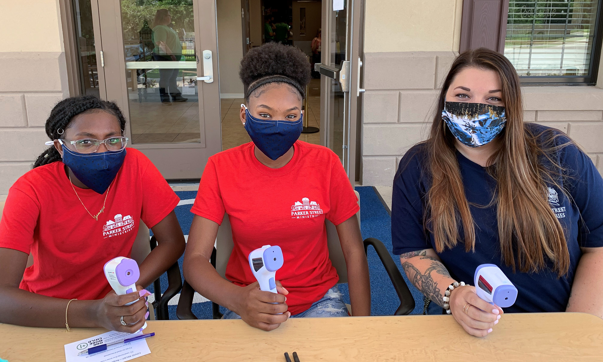 Volunteers taking temperatures at Florida Baptist Children's Home