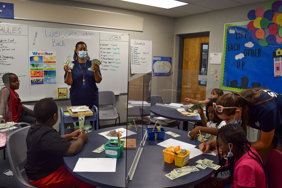 Students learning how to count money for Financial Fitness program